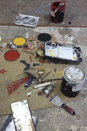 Barbara Downs' studio floor with a mess of painting supplies